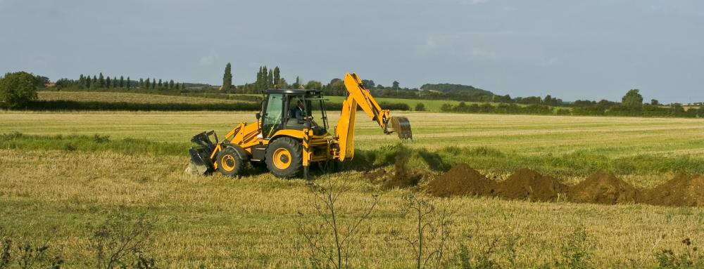 Property owners cannot regrade the soil or build structures on or near a drainage easement because it could impede the free flow of water over the property.