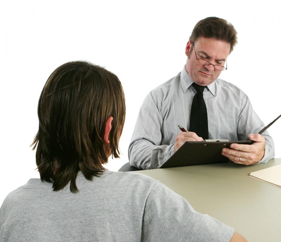 An officer records details of a complaint.