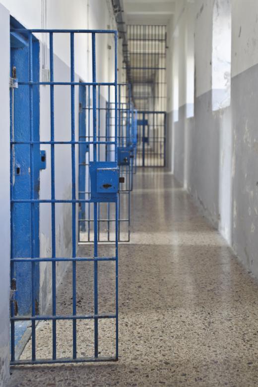 A holding cell is a small room designed for holding the inmates of a prison, jail, or other type of correctional facility.