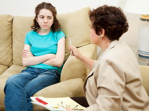 A therapist working with a juvenile offender.